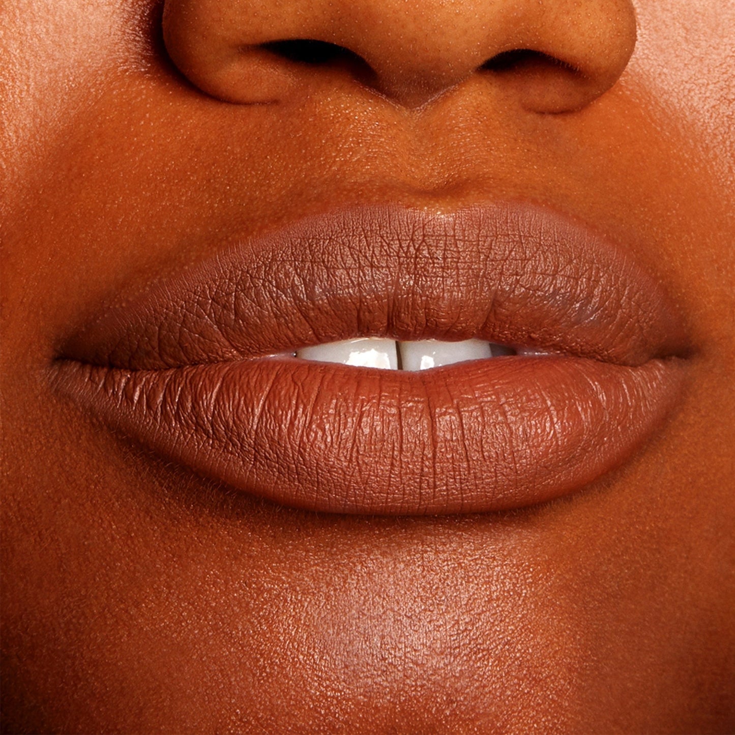 Lips softly parted and defined in a warm brown nude, wearing ColourPop Truth or Bare Lippie Pencil, showing precise outline and a smooth, creamy matte finish in a tight close-up beauty shot.