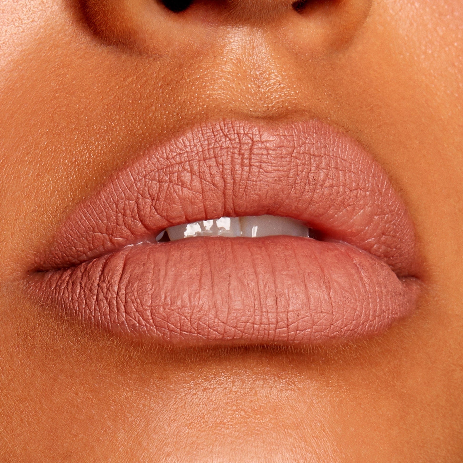 Full lips lined and filled with BFF Lippie Pencil by ColourPop in a nude-rose matte, showcasing precise definition and smooth payoff; studio close-up highlighting the long-wearing ColourPop Lippie Pencil finish.