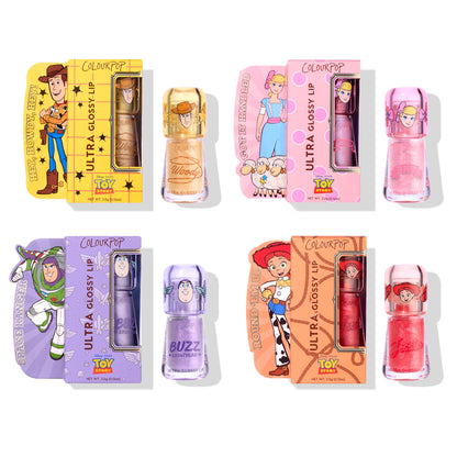 Squad Dreams ColourPop Ultra Glossy Lip set showcases four Toy Story–themed glosses - Woody warm gold shimmer, Bo Peep rosy pink sparkle, Buzz Lightyear lavender glitter, and Jessie bright red shimmer - displayed in character boxes on a white background.