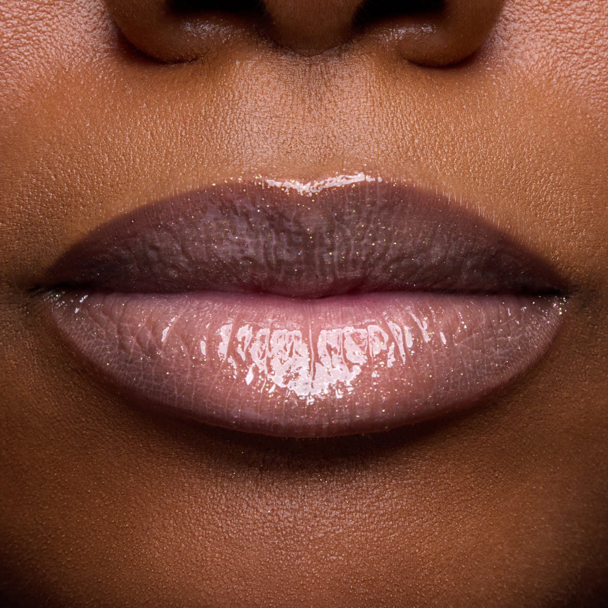 Close-up swatches of Colourpop Peach Mochi Fresh Kiss Glossy Balm on models’ lips, showing sheer peachy shimmer and high-shine finish, highlighting how this Lip Gloss & Lip Oil hybrid looks on different skin tones.