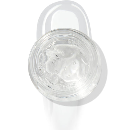 In The Clear Face & Eye Gloss in an open round jar gleams with a glossy swipe beneath it on a white background, showcasing the ColourPop Face & Eye Gloss for dewy, glass-skin shine on lids and cheeks.