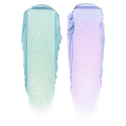 Two swatches display ColourPop Shadow Stix, Cute and Feisty - left a shimmering mint green, right an iridescent lavender with pink shift - swiped in thick vertical strokes on a white background.