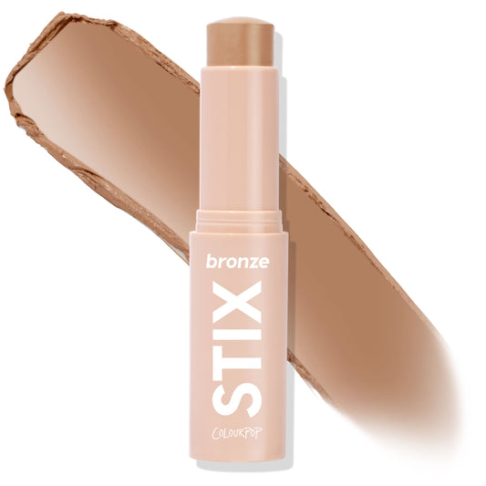 ColourPop Bronzer Stix in Laguna Beach shown uncapped, the twist-up cream bronzer bullet with a warm tan swatch behind on a white background, housed in a blush-pink tube labeled STIX and bronze for sun-kissed contour.