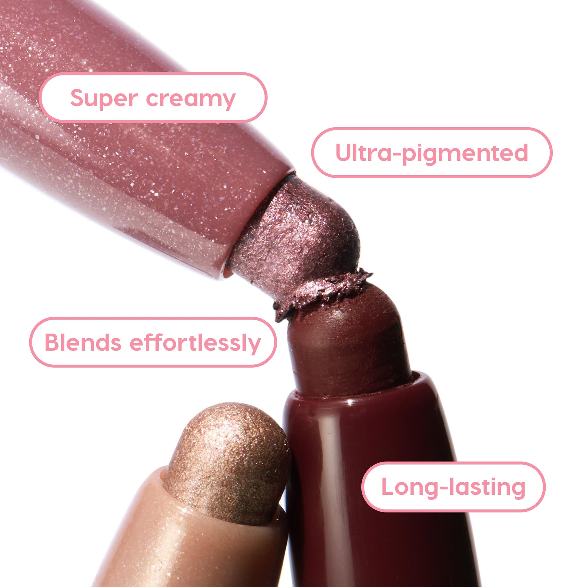 Rose Goals ColourPop Shadow Stix twist-up eyeshadow tips touch in a close-up, showcasing creamy, ultra-pigmented rose and mauve shimmer that blends effortlessly and lasts long, with a champagne shade below and deep berry casing in studio light.