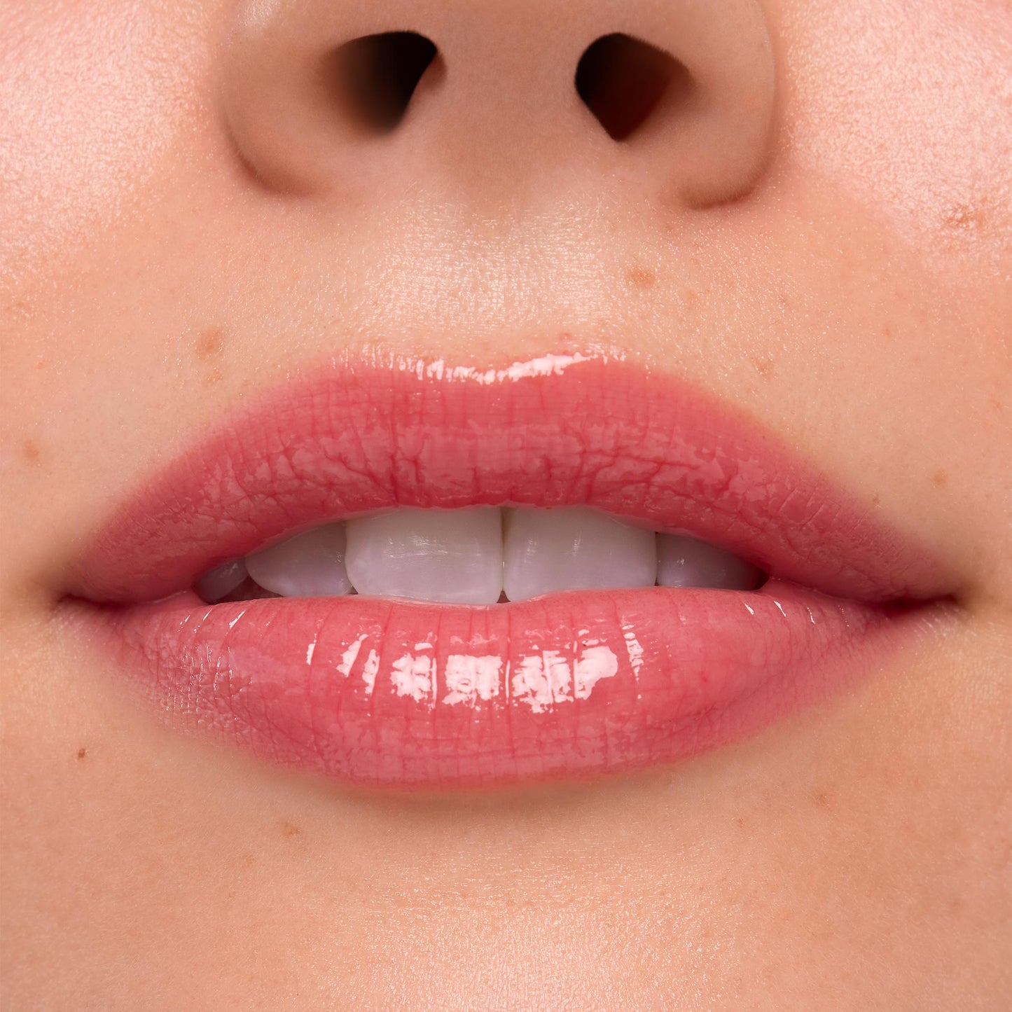 Lips wearing Experiment 626, the ColourPop Ultra Glossy Lip, gleaming with a high-shine sheer rosy pink finish in a tight close-up studio swatch, emphasizing smooth texture and natural lip lines.