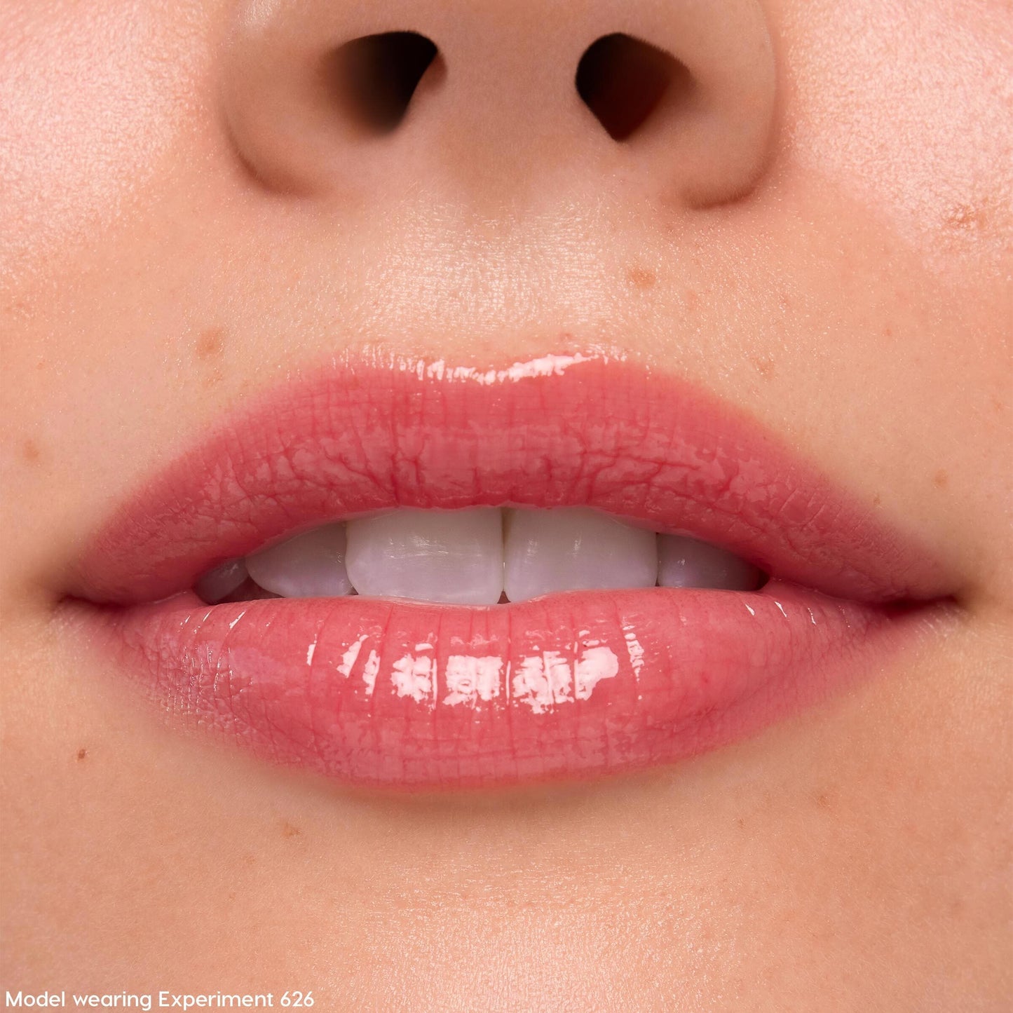 Lips coated in Keepin’ It Sweet Ultra Glossy Lip (ColourPop Ultra Glossy Lip) gleam with a sheer pink, glassy finish in a tight close-up, highlighting smooth texture and shine around the mouth.